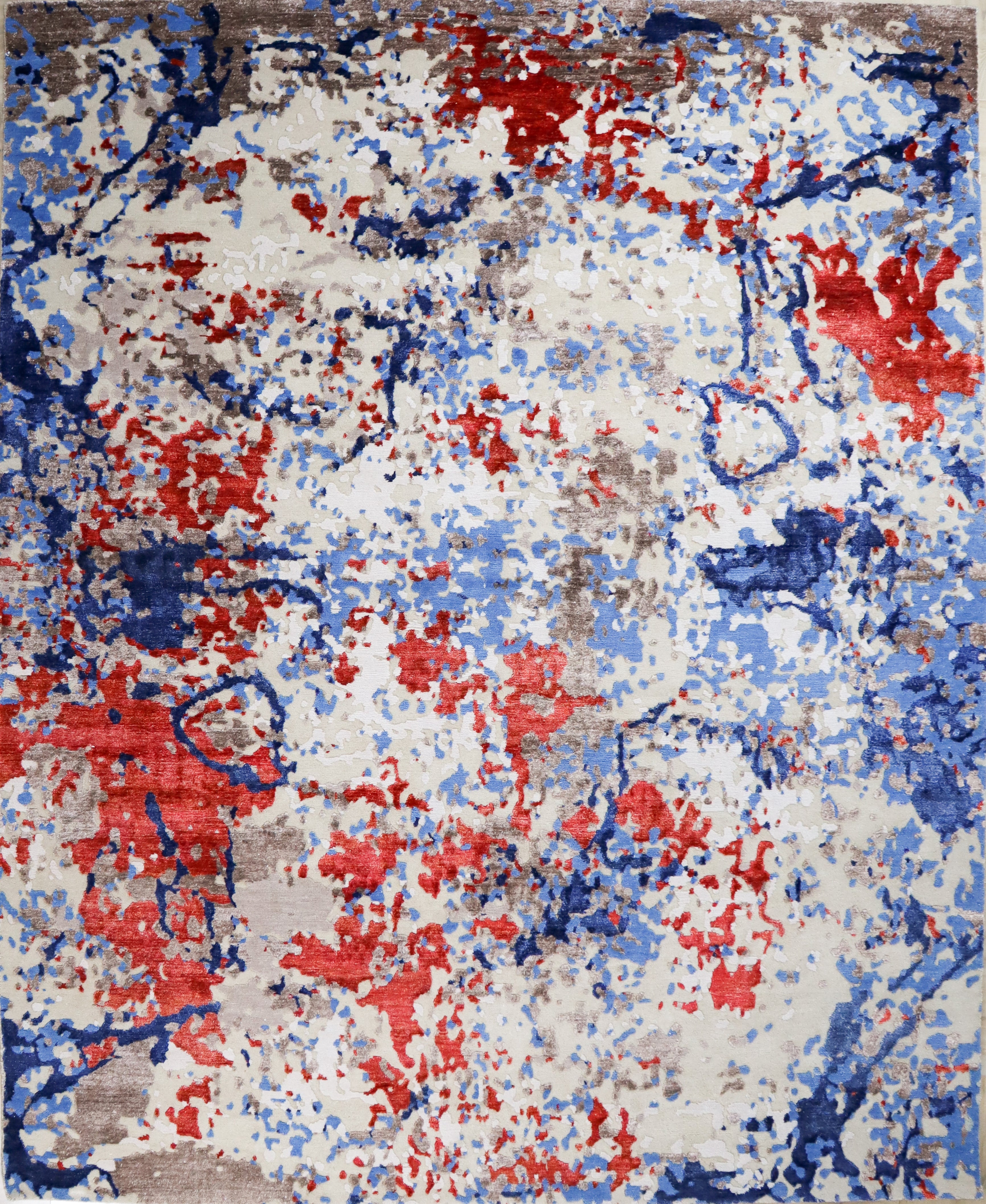 Abstract rug with red, blue, and white colors on a brown background